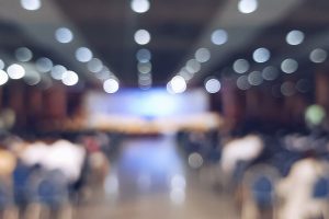 blurred people sitting at the conference